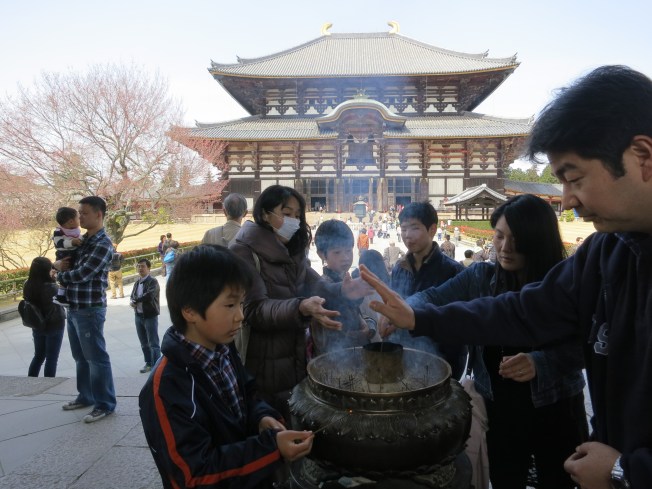 Burning incense outside Todai-ji
