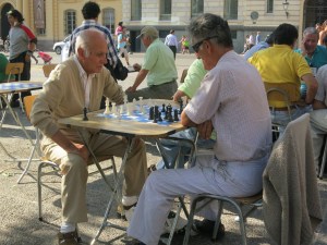 Two men play chess in Plaza de Armas